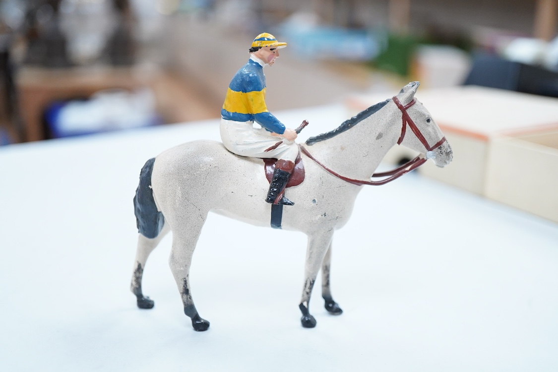 Two boxed Britains Racing Colours of Famous Owners series lead mounted figures; Miss Dorothy Paget - rider in yellow-striped blue jersey on a grey horse, and Msr. M. Boussac - rider in orange jersey on a dark brown horse